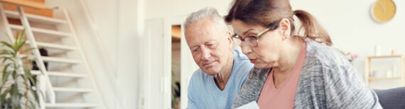 Old Couple Checking Finances | Feature image for the blog Centrelink and aged care